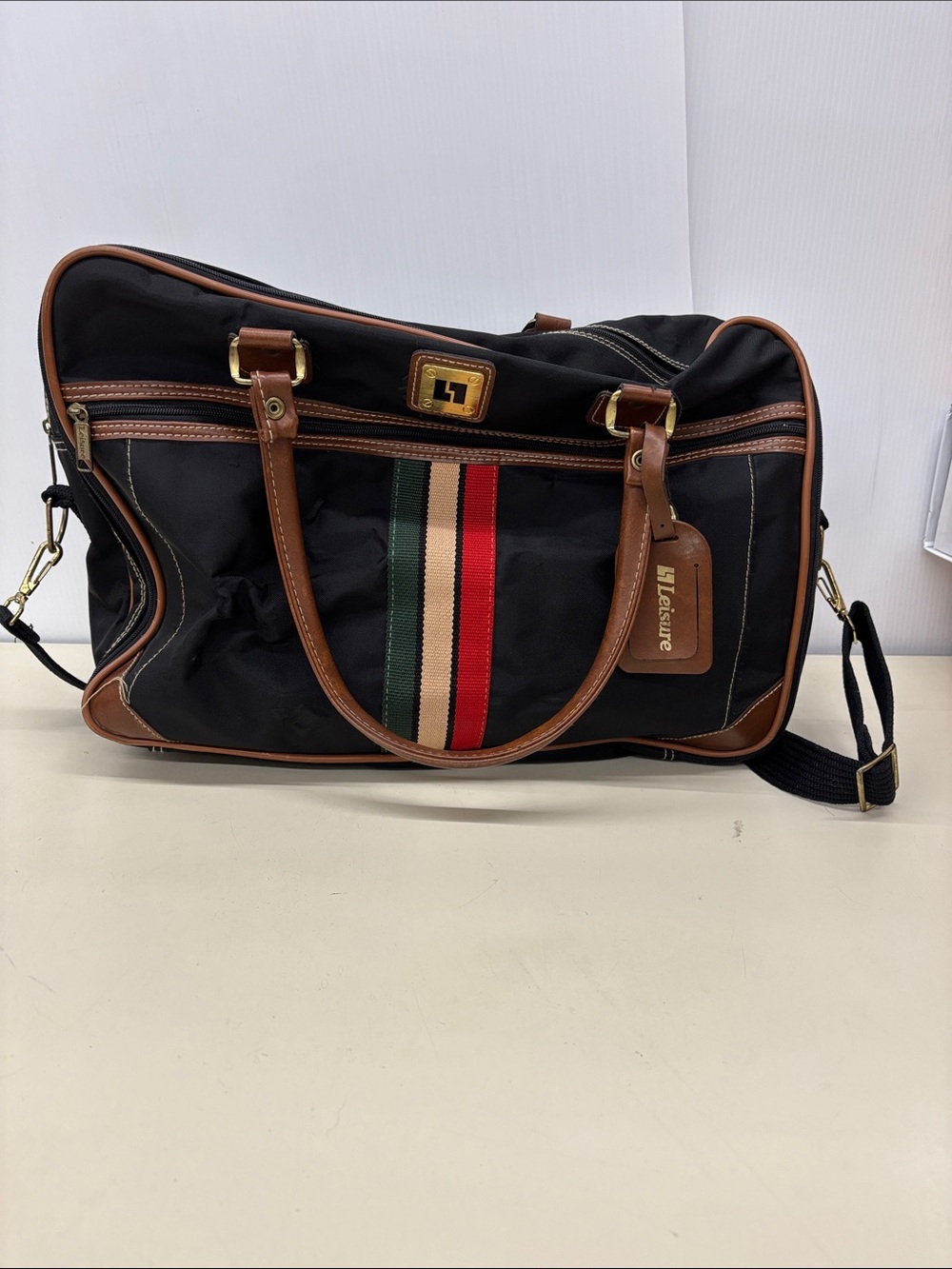Leisure Black Travel Duffel Bag with Brown Trim and Stripe Accent